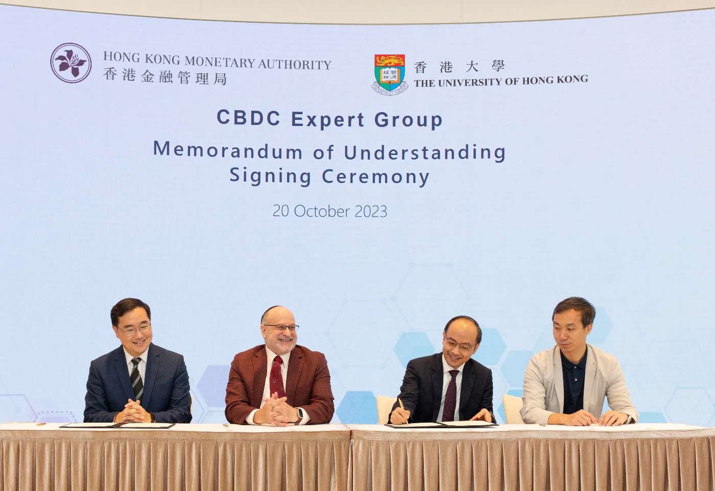 HKU and HKMA sign MOU. (From left) Mr Colin POU, Executive Director (Financial Infrastructure), HKMA; Professor David SROLOVITZ, Professor Simon YOUNG and Professor Chen LIN