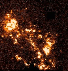 In this rendition the red image has been subtracted from the H-alpha image which mostly cancels the contributions from normal stars and is effective in highlighting just the areas of active star formation. For clarity, uncancelled stellar residuals have been removed.