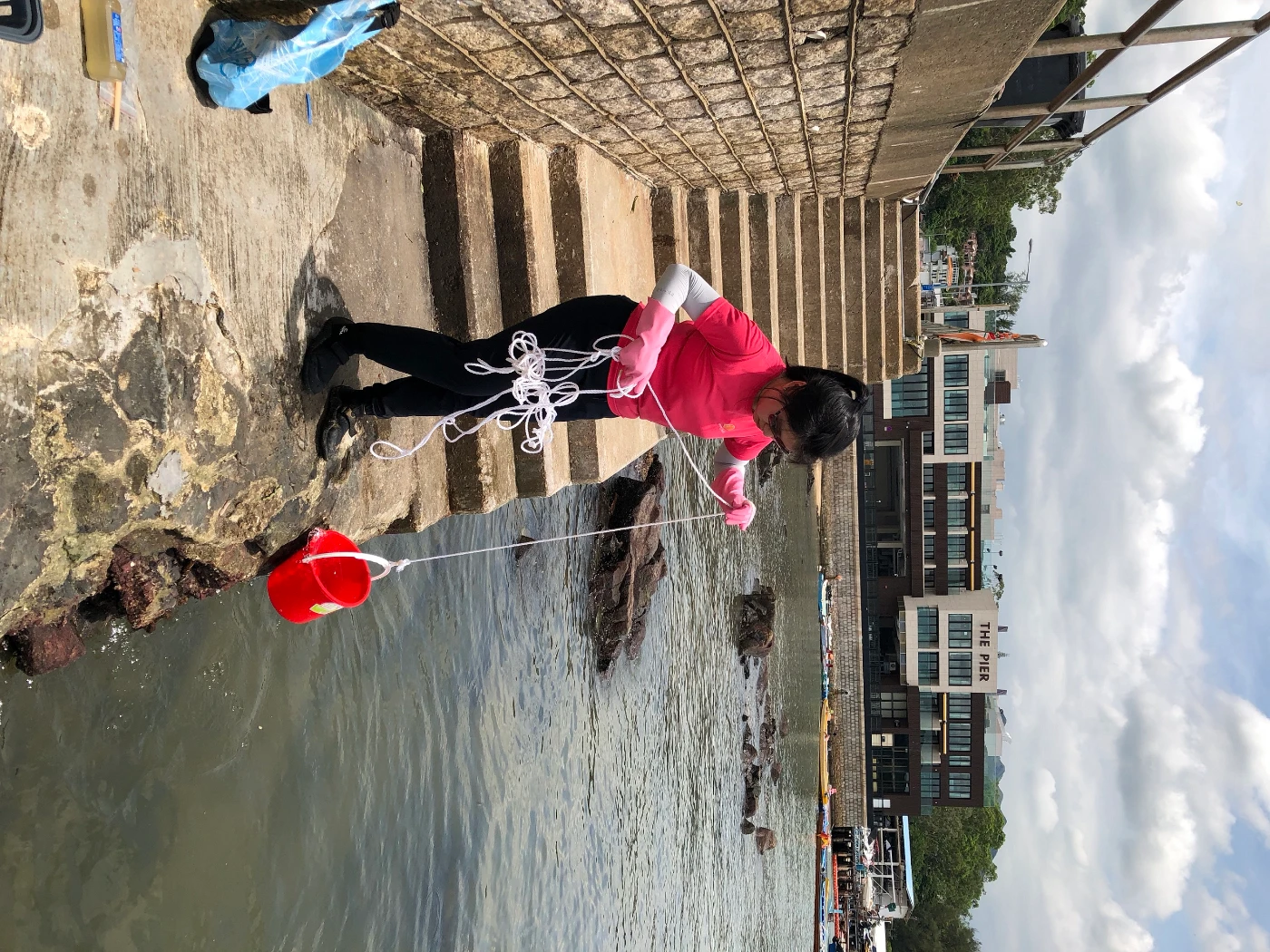 Katie Yeung collects a seawater sample from Sai Kung
