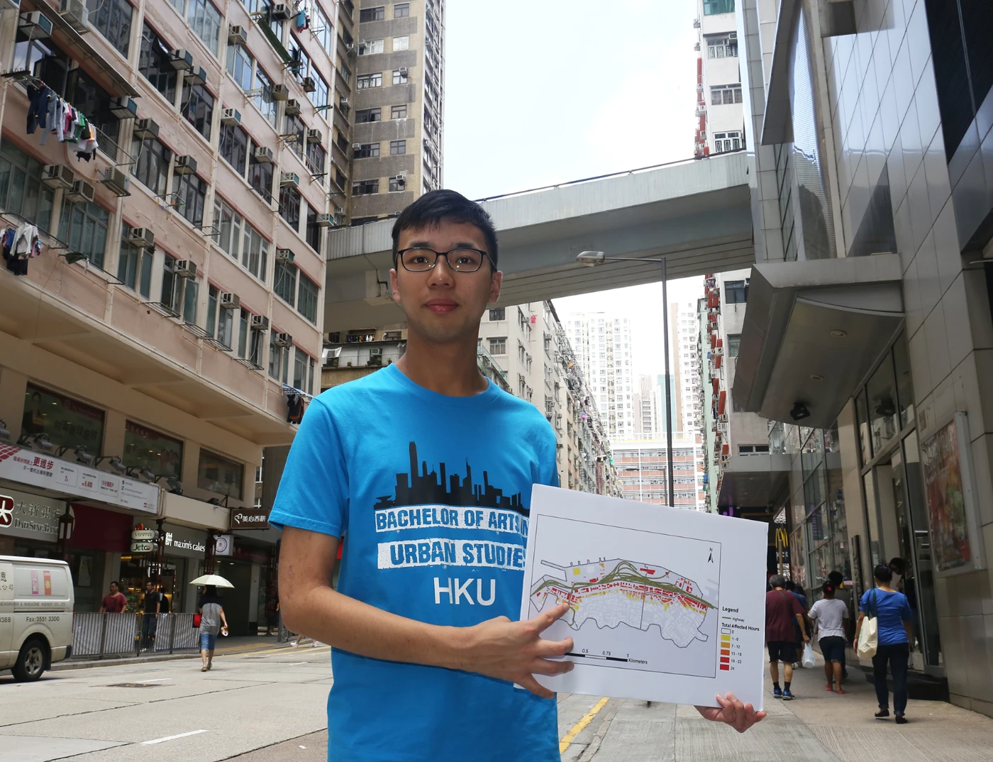 Kenneth illustrates the impact of noise pollution on some buildings located at the intersection of Hill Road and Queen's Road West.