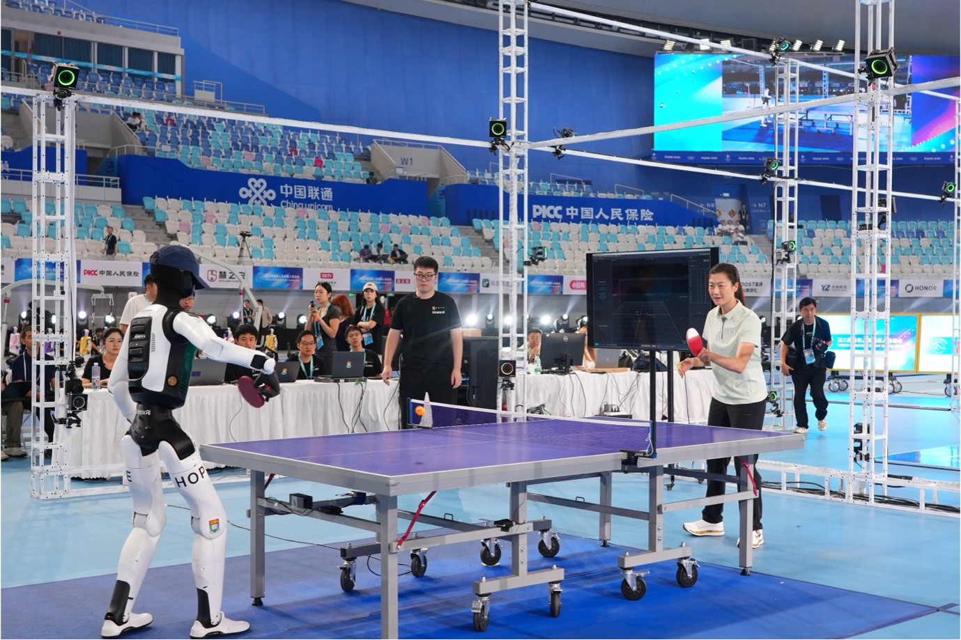 The team rallies with Olympic and World Table Tennis Champion Ding Ning during the opening ceremony of the Games.