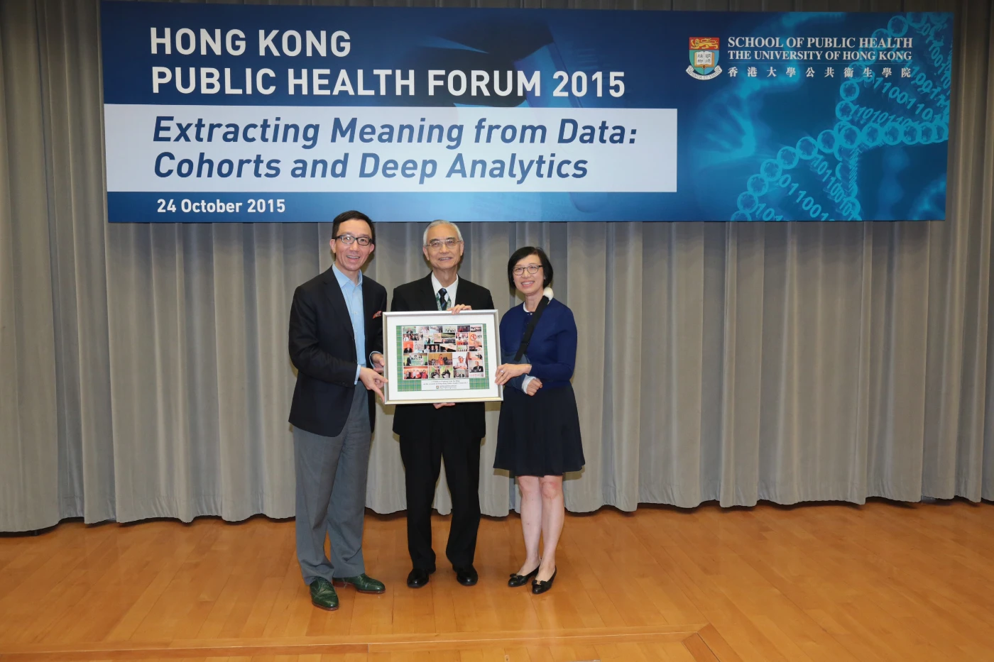 Professor Sophia Chan, Under Secretary for Food and Health, and Professor Gabriel M Leung, Chair Professor of Public Health Medicine and Dean of Medicine, jointly present a memento to Professor TH Lam in recognition of his outstanding contributions to public health.