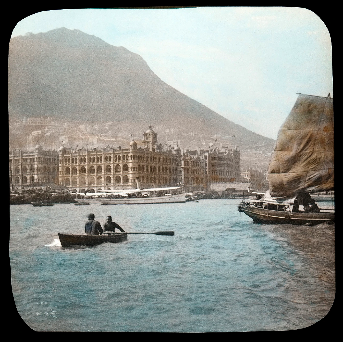 Hong Kong Harbour:
     Queen's Building, Central waterfront, and Kowloon Ferry Pier
     1908
     Hand-coloured glass slide
     30 x 30 cm